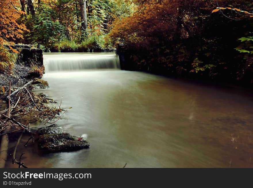 Autumn scene, waterfall in the forest