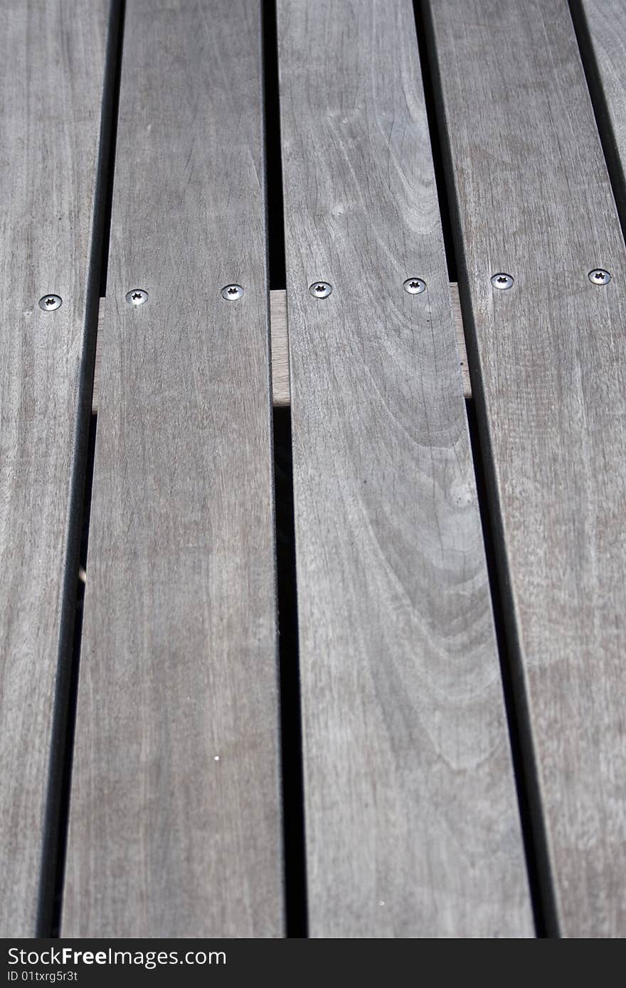 Wood on a deck with the screws showing. Wood on a deck with the screws showing