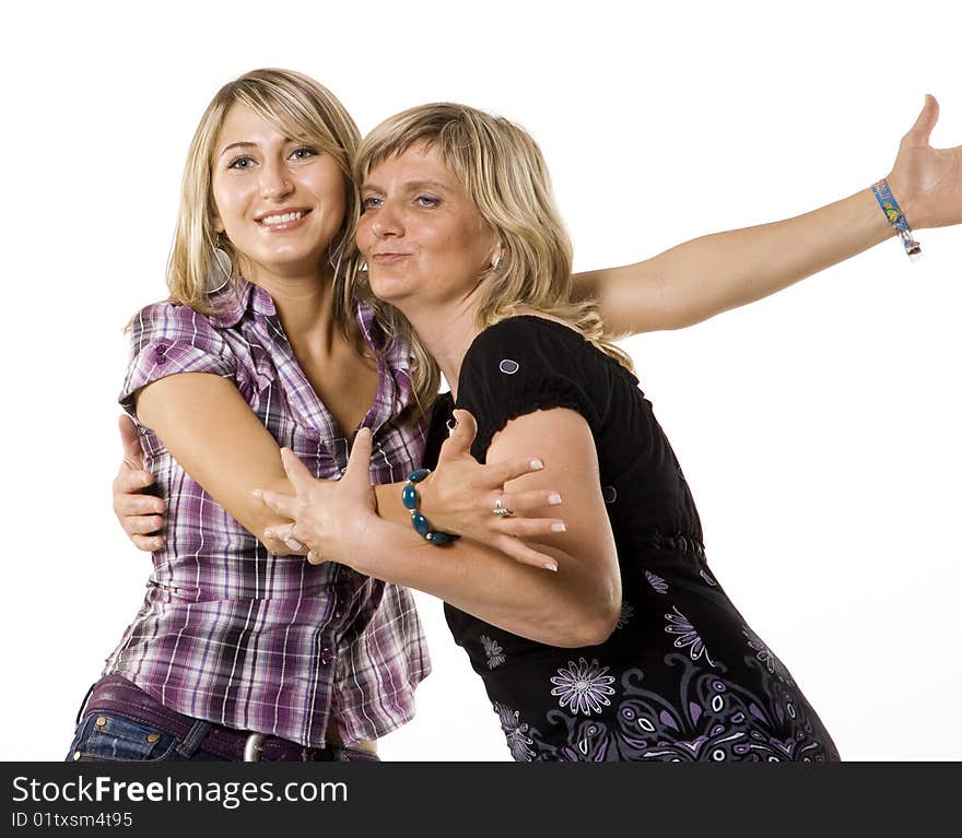 Mother and teenage daughter hugging