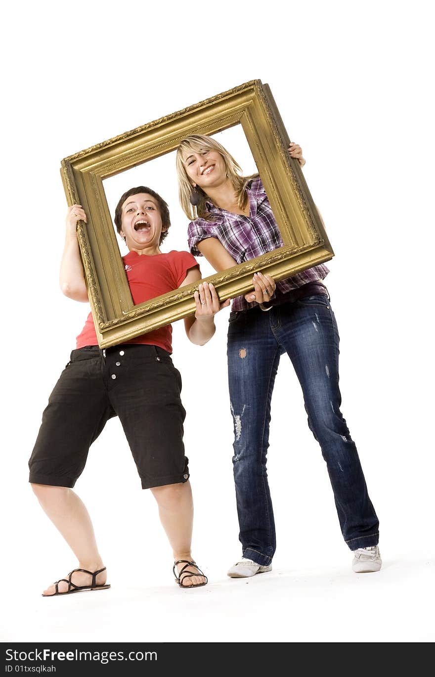 Young women posing with picture frame