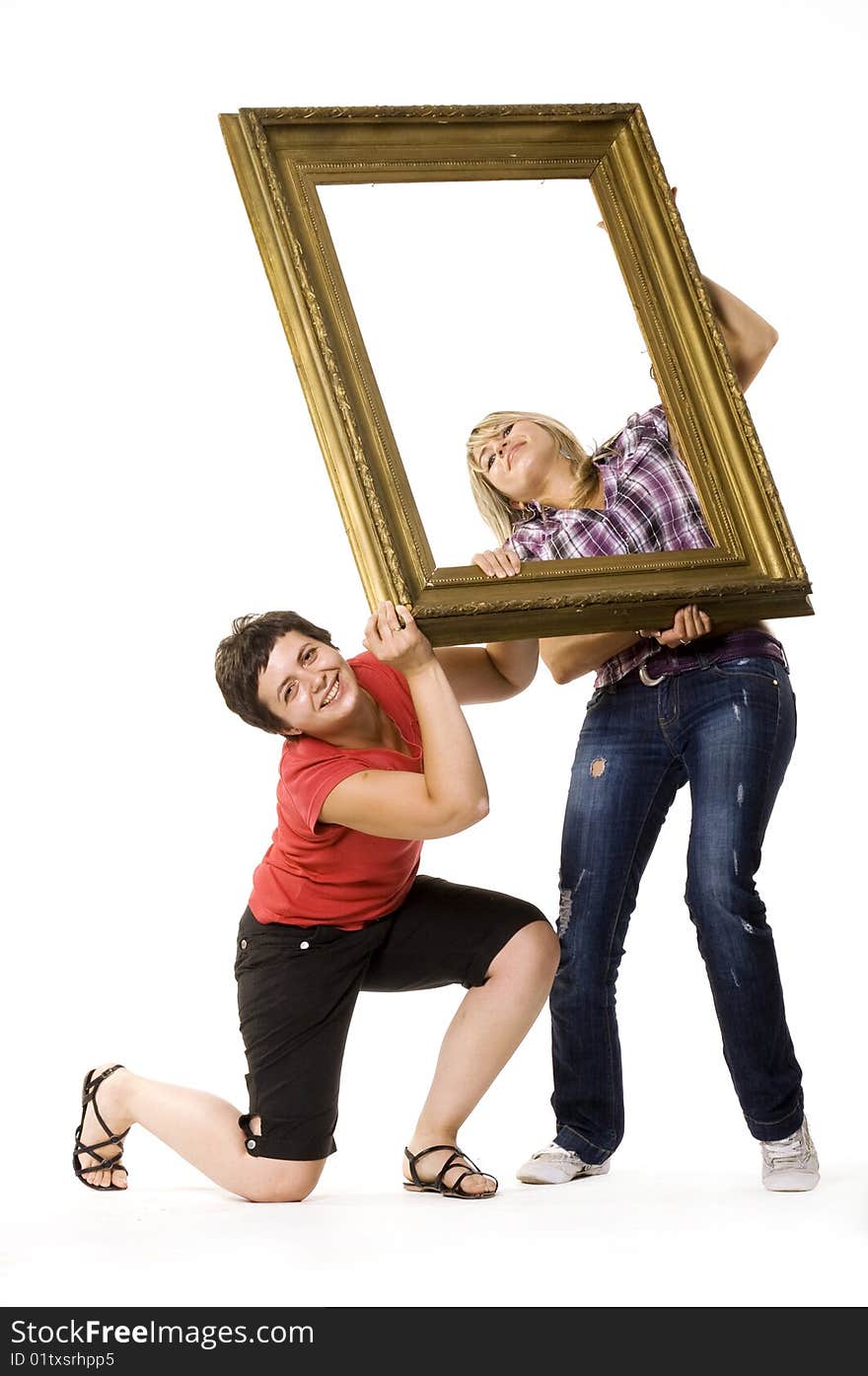 Young women holding wooden frame