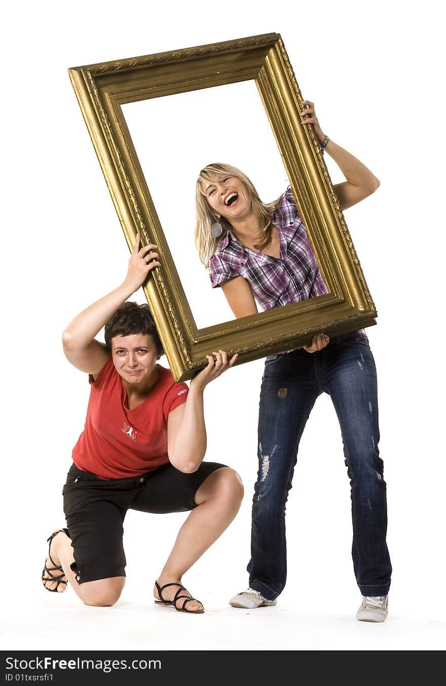 Young women posing with picture frame