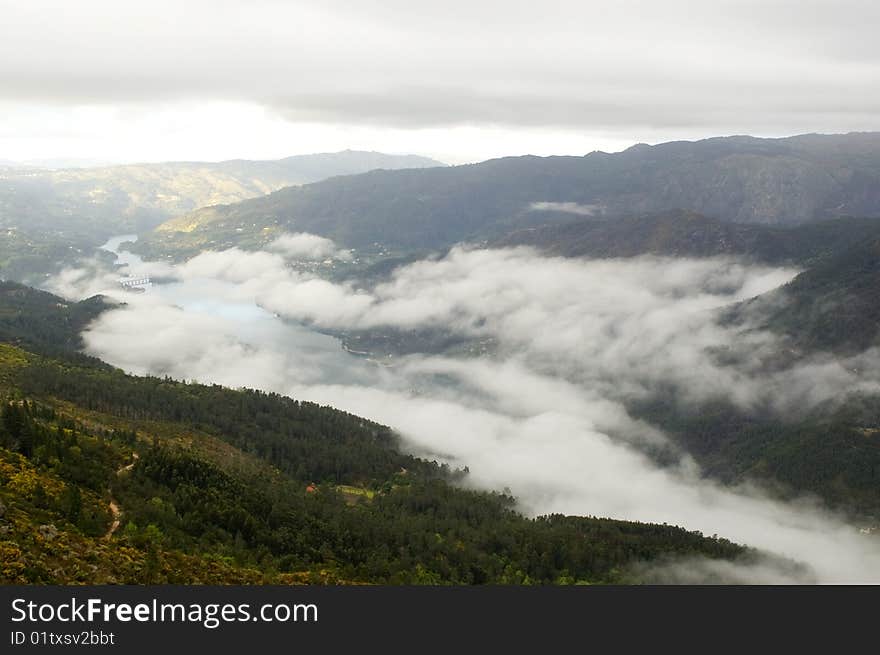 A beautiful and foggy landscape and mountains. A beautiful and foggy landscape and mountains