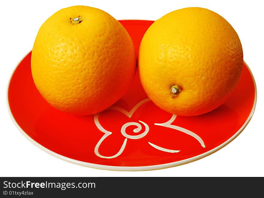 Two oranges on plate isolated on white background