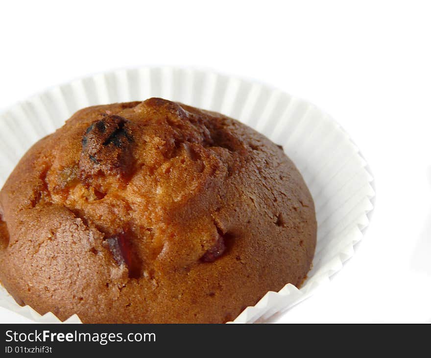 Fruit cupcake isolated over white background. Shallow dof.