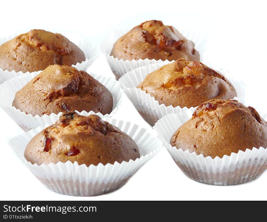 Fruit cupcakes isolated over white background. Shallow dof.