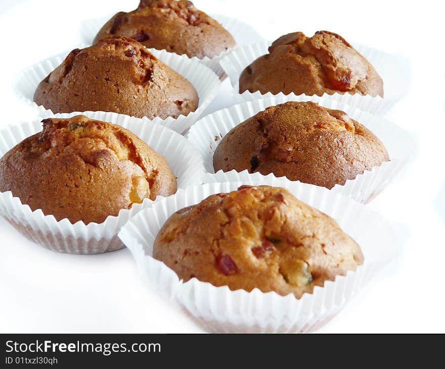 Fruit cupcakes isolated over white background. Shallow dof.