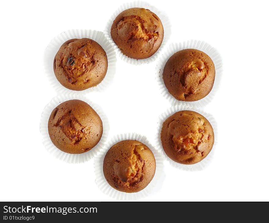 Fruit cupcakes isolated over white background. Shallow dof.