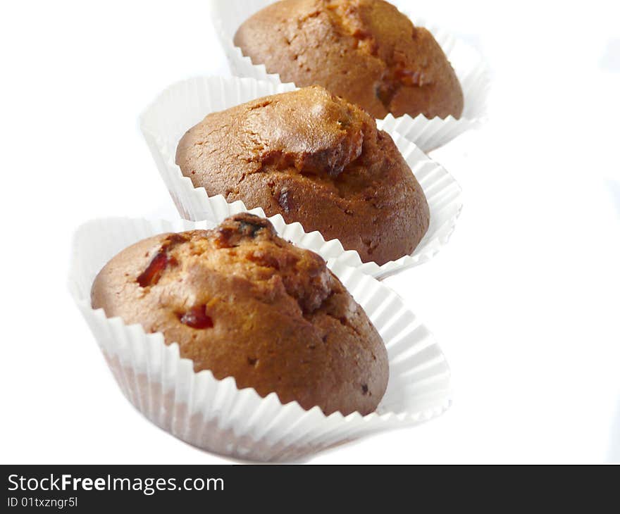 Fruit cupcakes isolated over white background. Shallow dof.