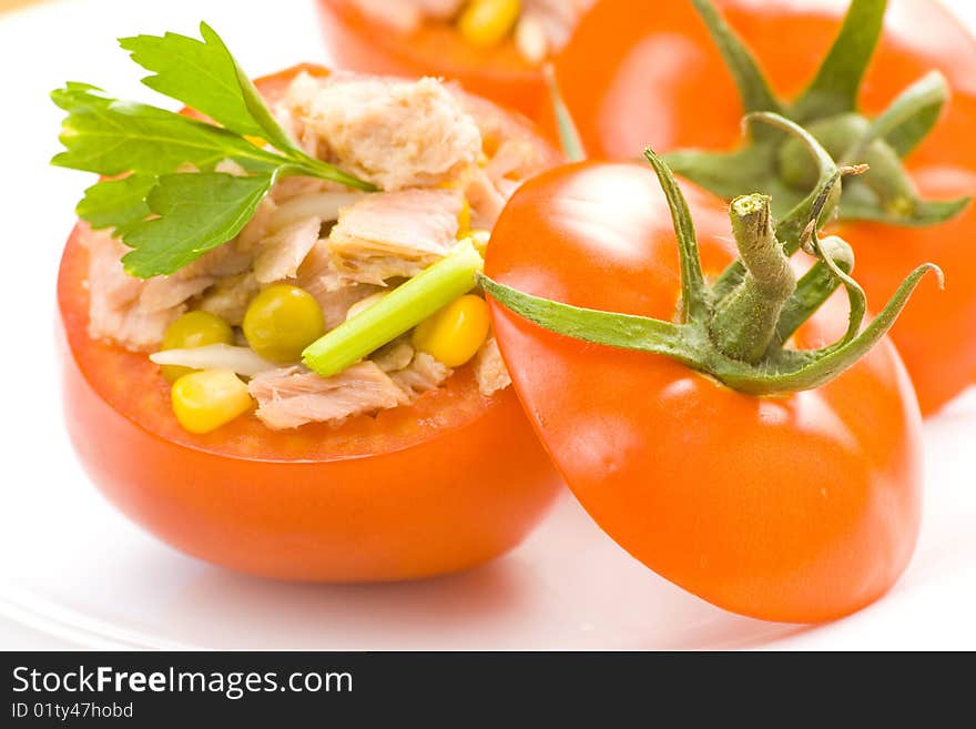 Tomatoes stuffed with tuna celery peas corn and soybeans. Tomatoes stuffed with tuna celery peas corn and soybeans