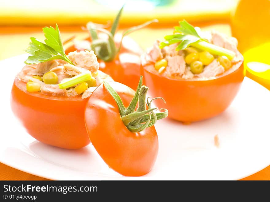 Tomatoes stuffed with tuna celery peas corn and soybeans. Tomatoes stuffed with tuna celery peas corn and soybeans