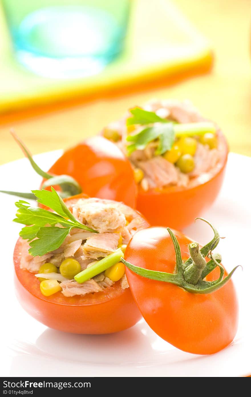 Tomatoes stuffed with tuna celery peas corn and soybeans. Tomatoes stuffed with tuna celery peas corn and soybeans