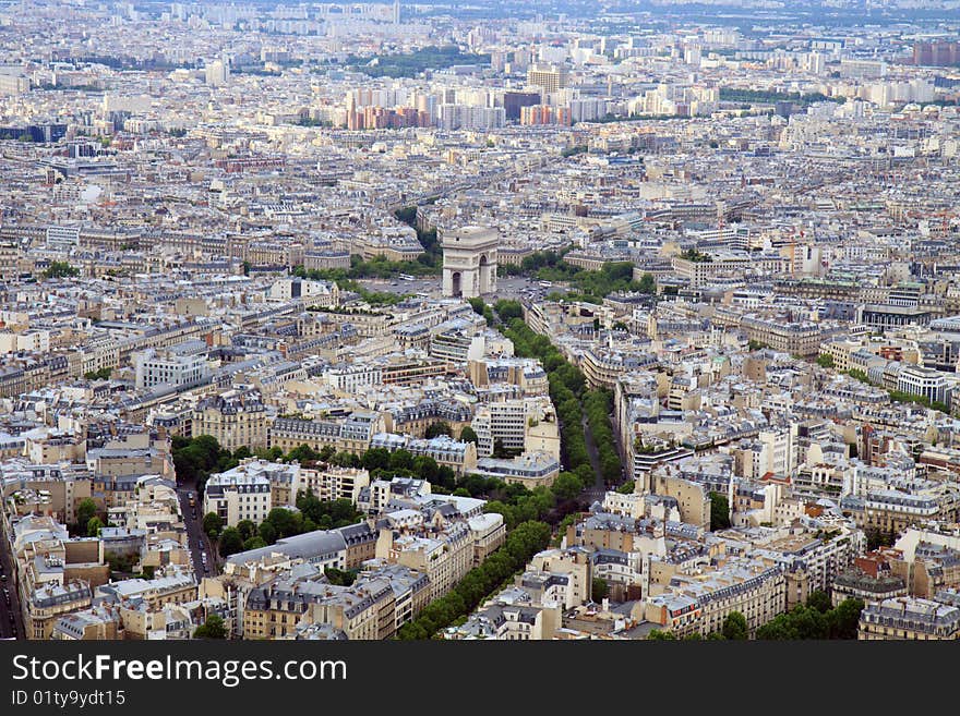 The skyline of Paris, France seen from the Eiffel Tower, with a focus on the Arc de Triomphe