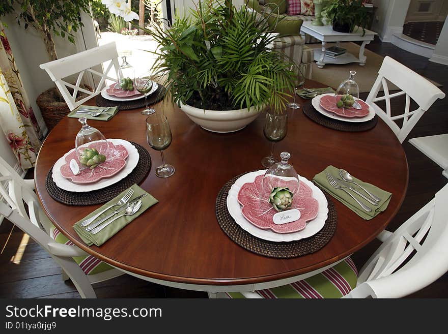 Dining table with modern tableware and decor. Dining table with modern tableware and decor.