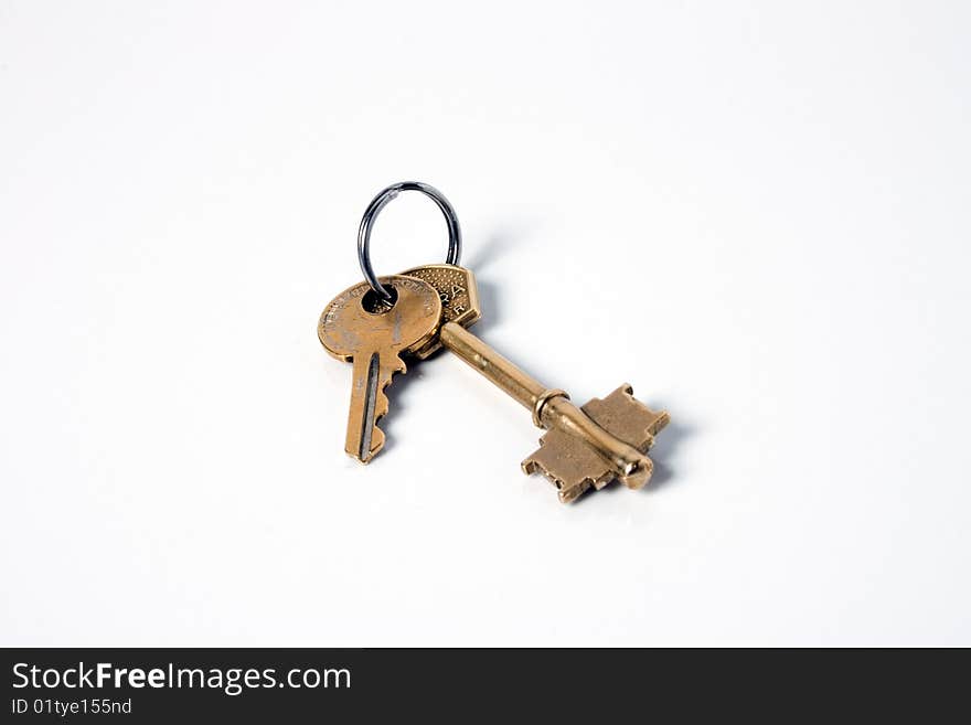 Two bronze keys isolated on white background. Two bronze keys isolated on white background