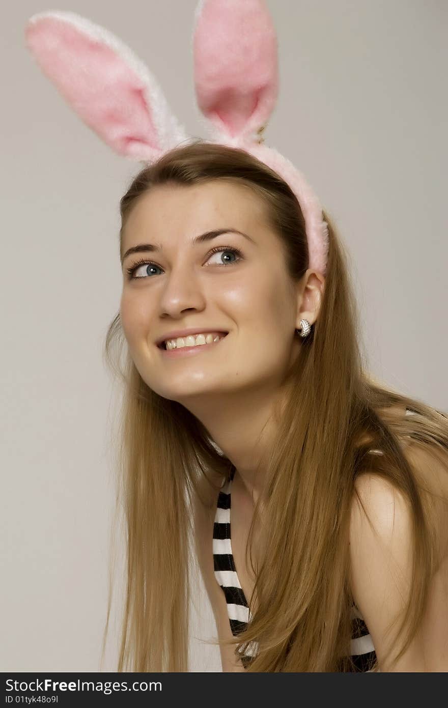 Girl in pink rabbit ears and handcuffs