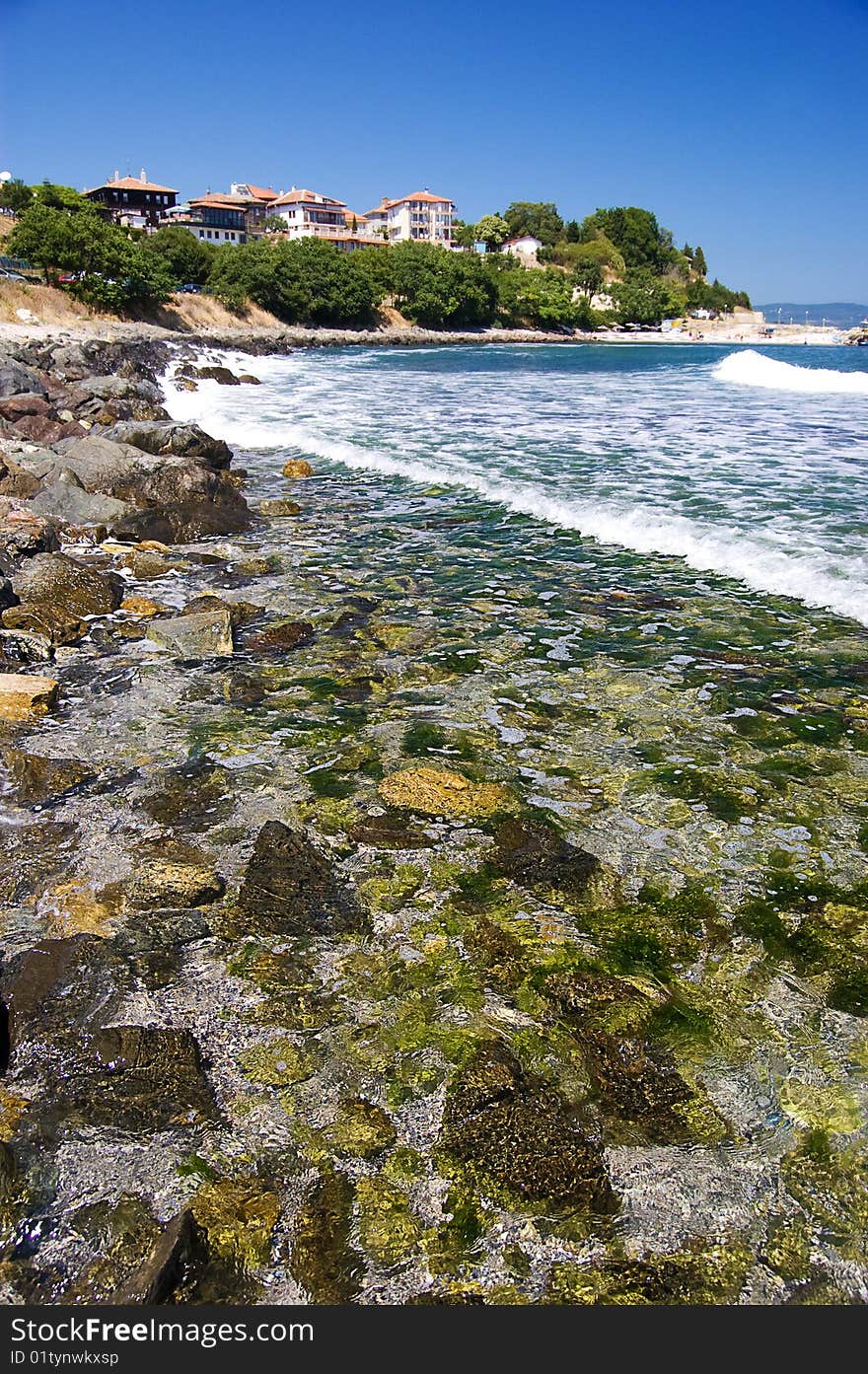 Stony beach and some houses