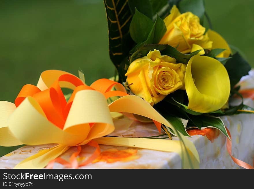 Decorated present with yellow rose bouquet