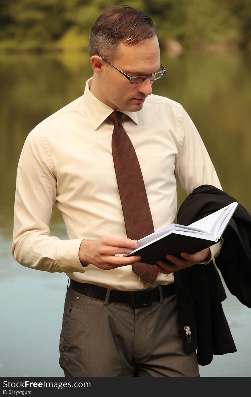 Businessman Looking In His Organizer