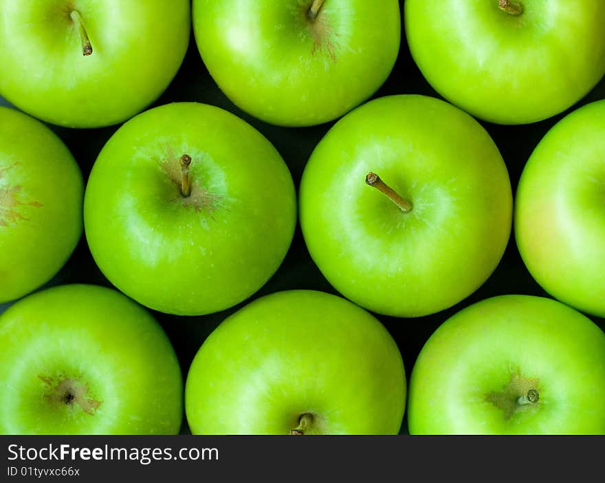 Green apples background closeup