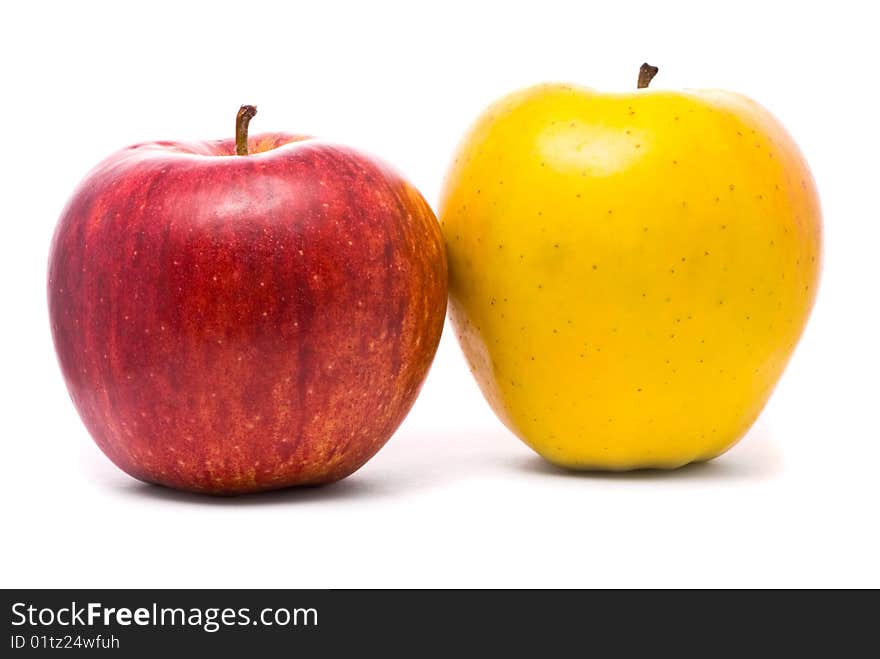 Red and yellow fresh apples on studio white