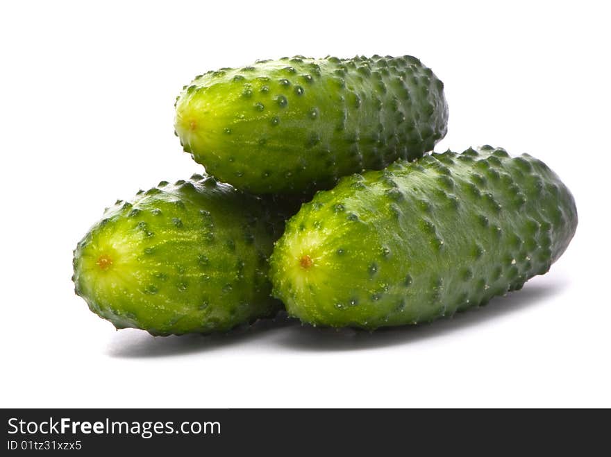 Fresh cucumbers on studio white