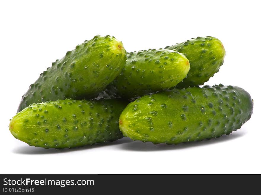 Fresh cucumbers on studio white