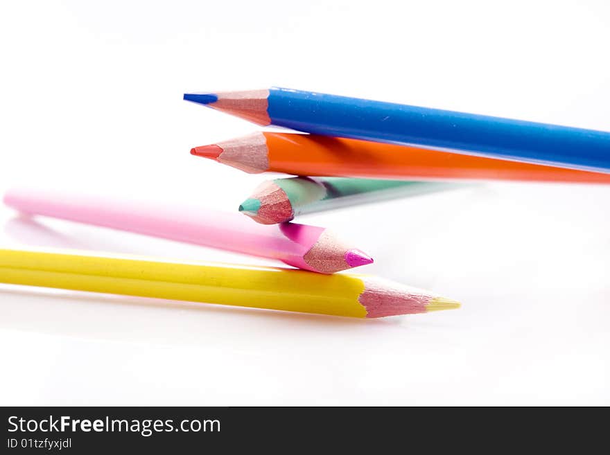 Brunch of colored crayons on white