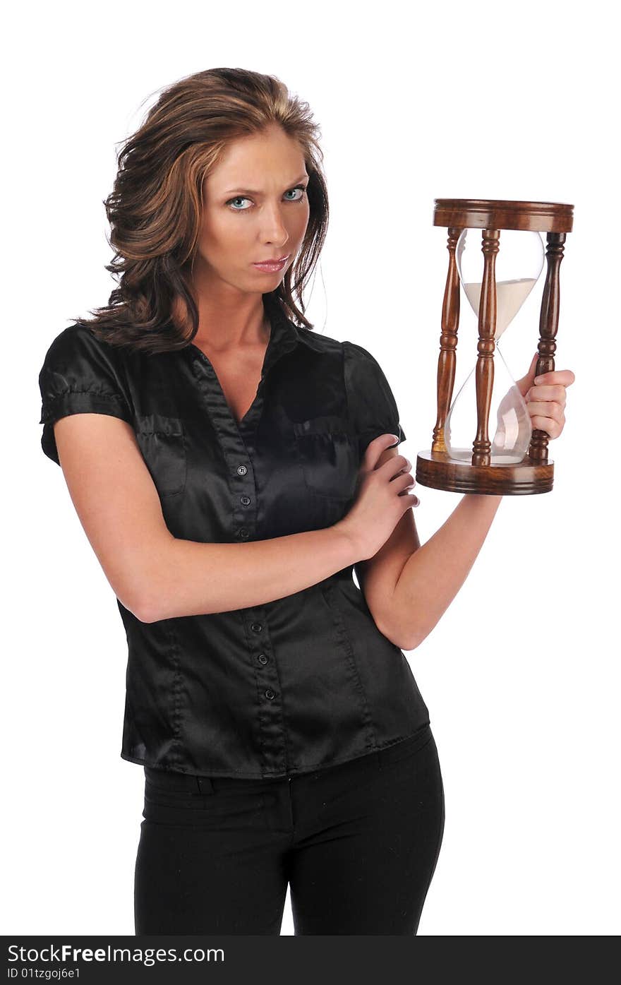 Businesswoman holding a sand timer isolated against a white background