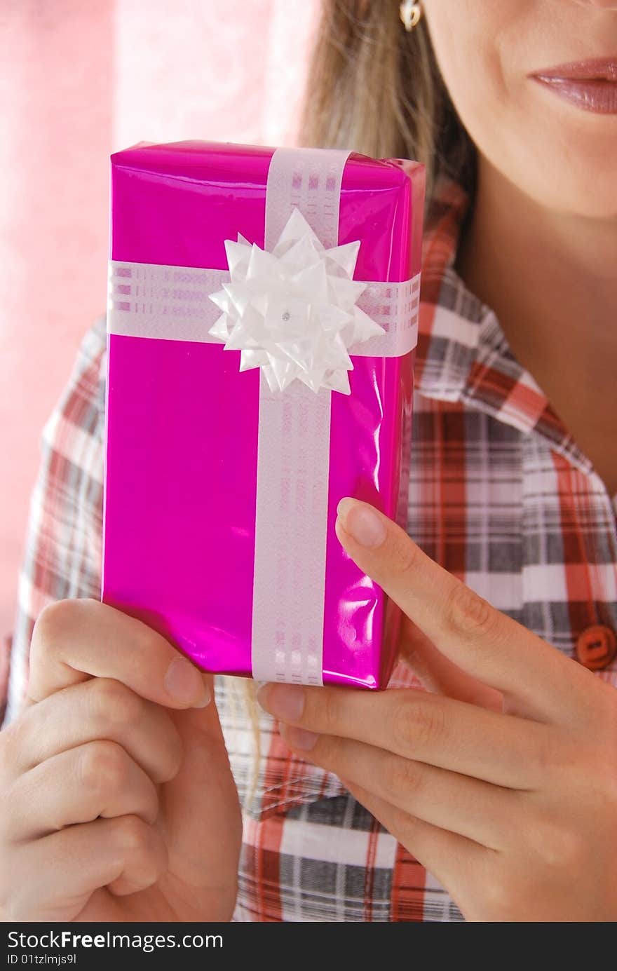 Woman holds a box with a gift. Woman holds a box with a gift