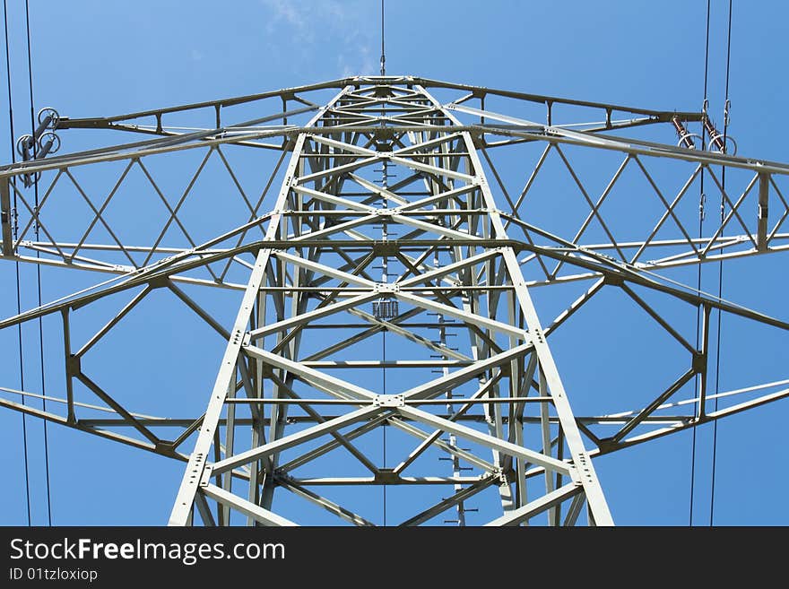 Electric power transmission on a background of the blue sky. Electric power transmission on a background of the blue sky