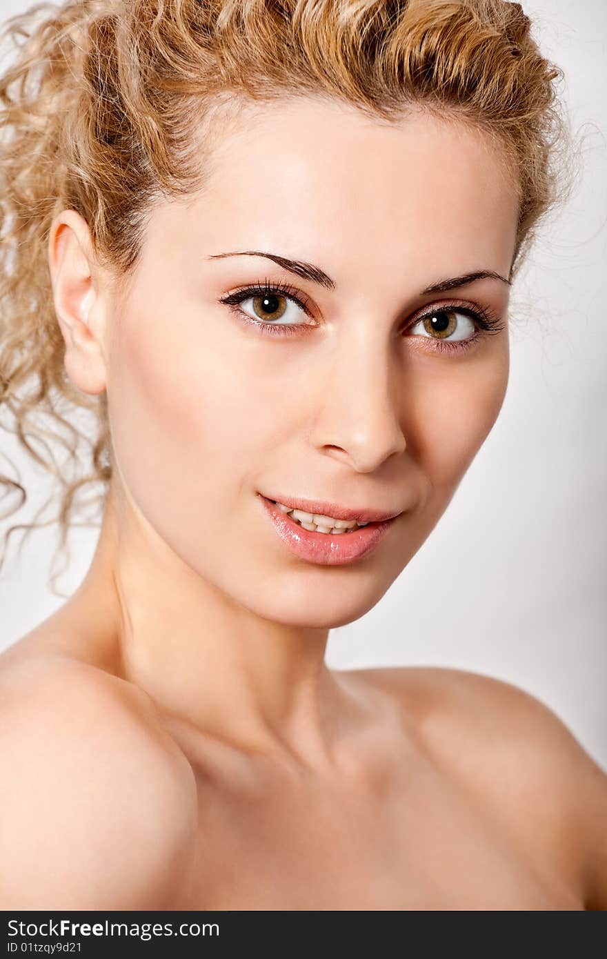 Closeup portrait of young blond curly hair woman