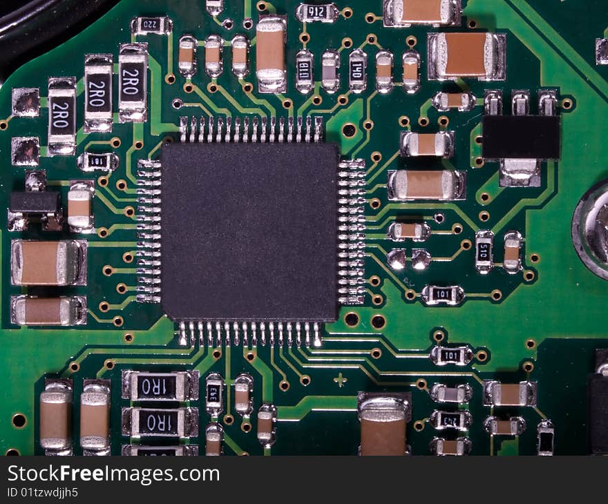 A close up of a green computer circuit. A close up of a green computer circuit.