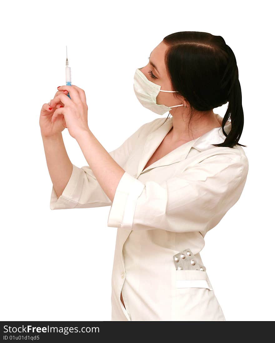 Doctor in a white robe and a mask with syringe