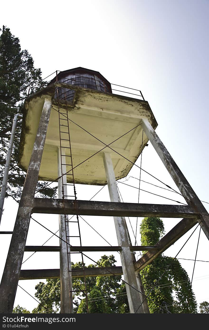 An abandoned water tower from below. An abandoned water tower from below.