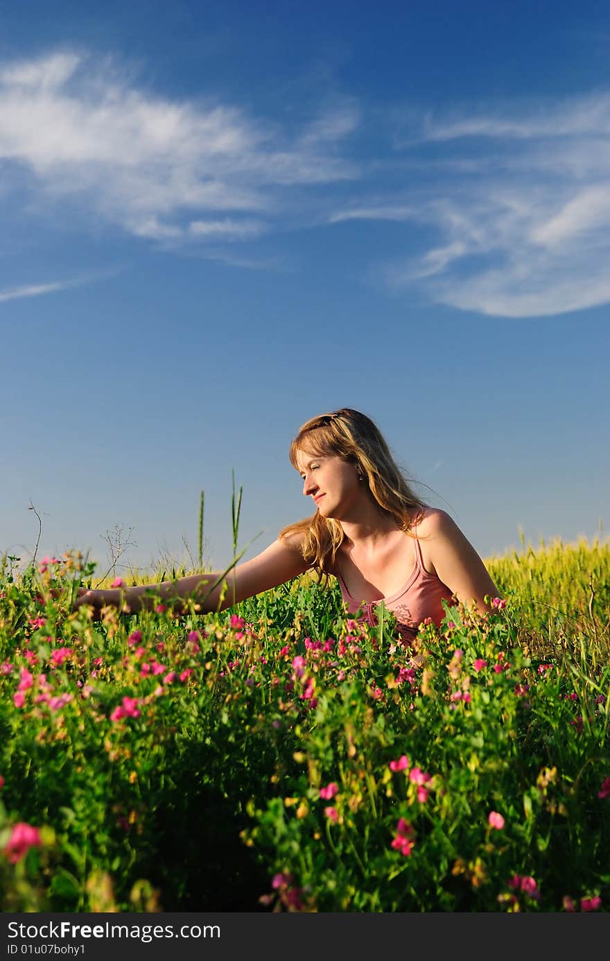 The girl collects wild flowers