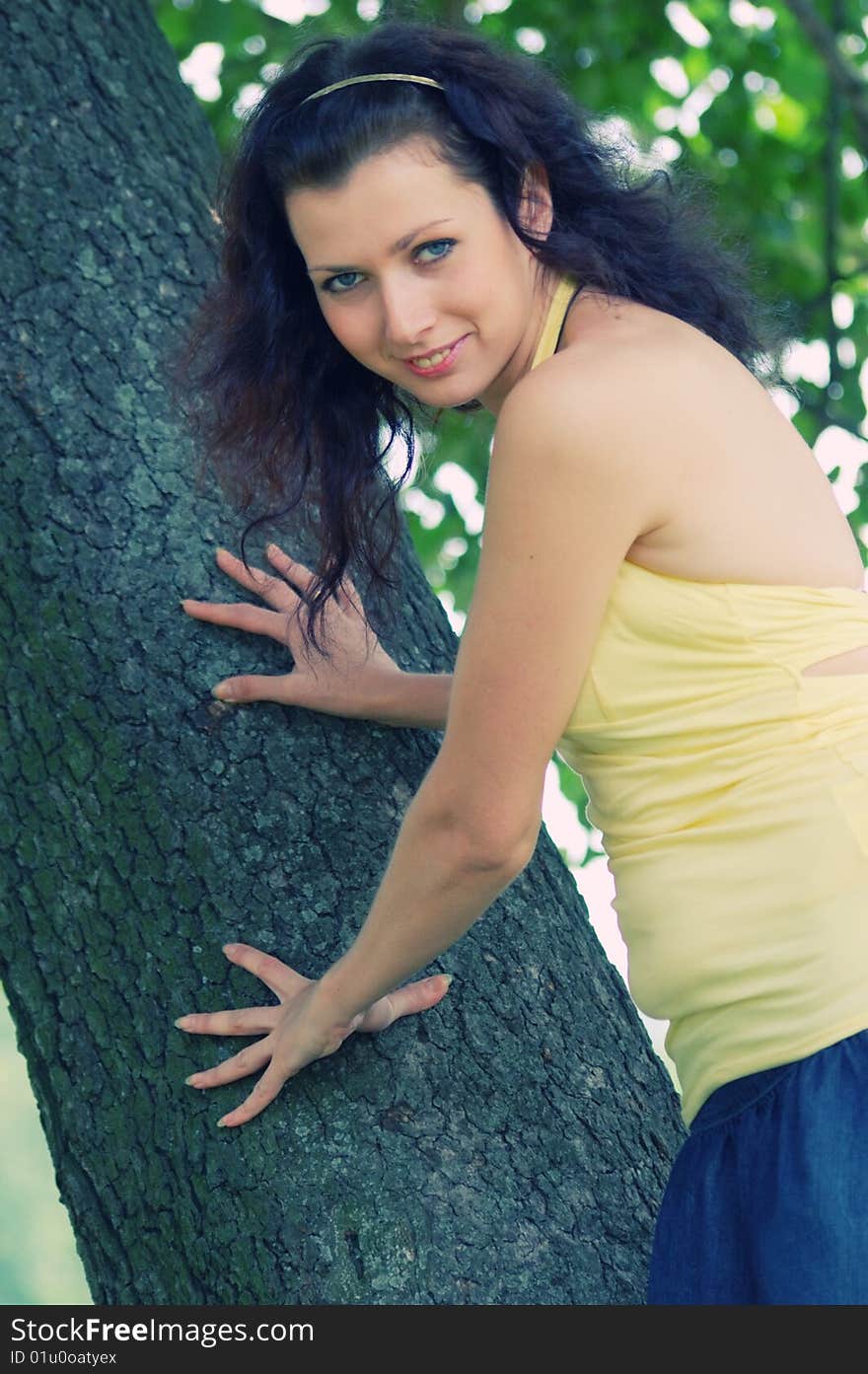 Pretty brown-haired typical russian girl near tree (CROSSPROCESSED). Pretty brown-haired typical russian girl near tree (CROSSPROCESSED)