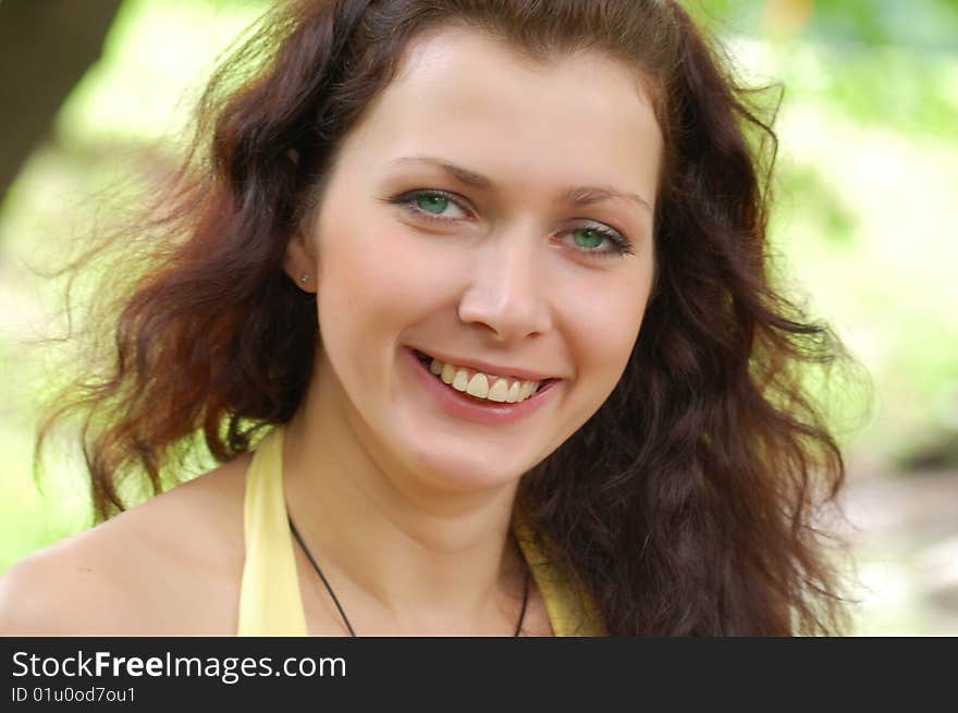 Pretty brown-haired typical russian girl with water on background. Pretty brown-haired typical russian girl with water on background