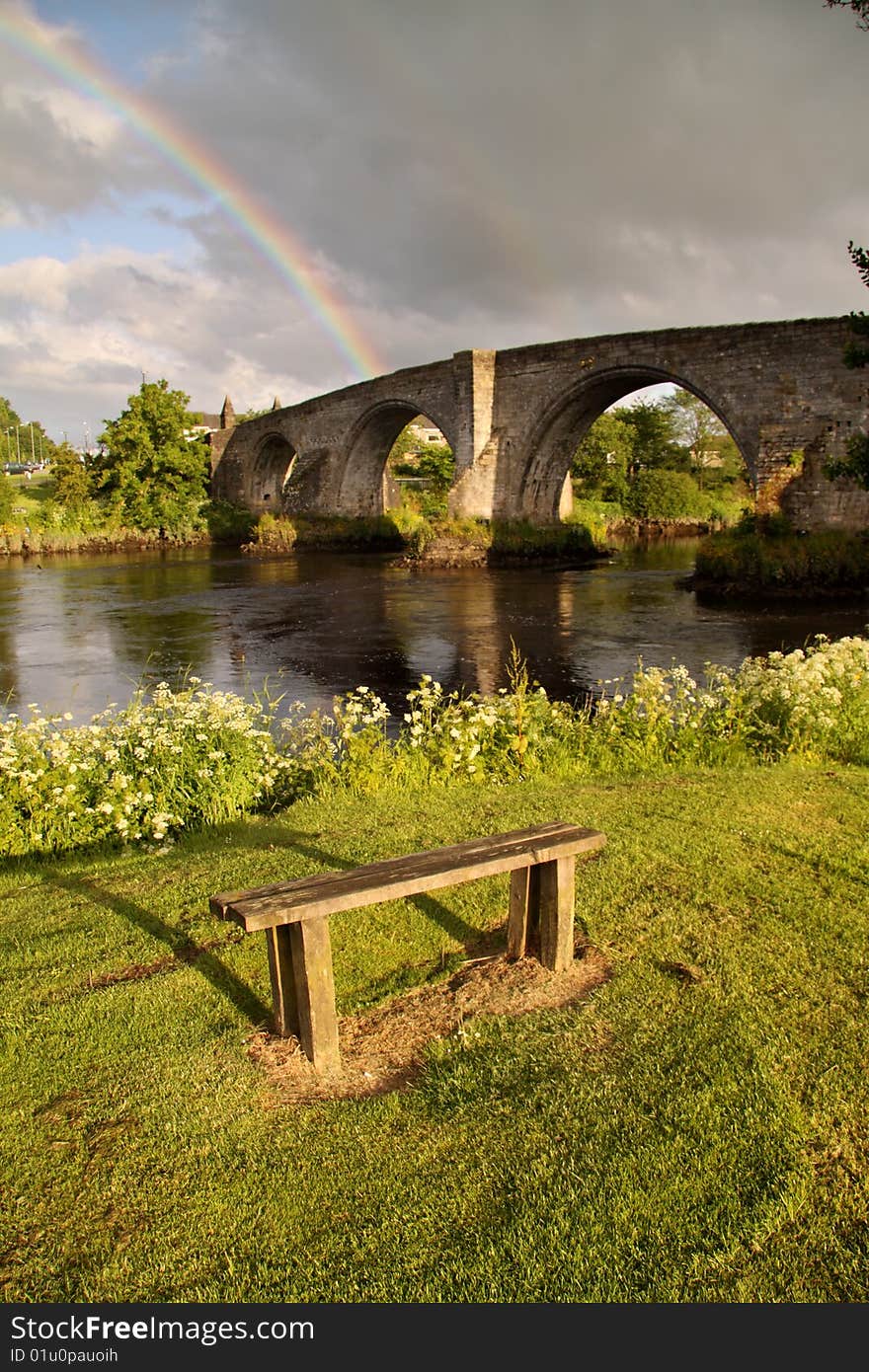 The ancient medieval bridge at Stirling captured in the soft light of early morning with a rainbow in the background. The ancient medieval bridge at Stirling captured in the soft light of early morning with a rainbow in the background.