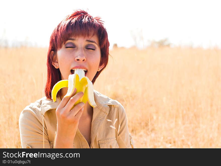 Woman enjoys a banana fruit. Woman enjoys a banana fruit