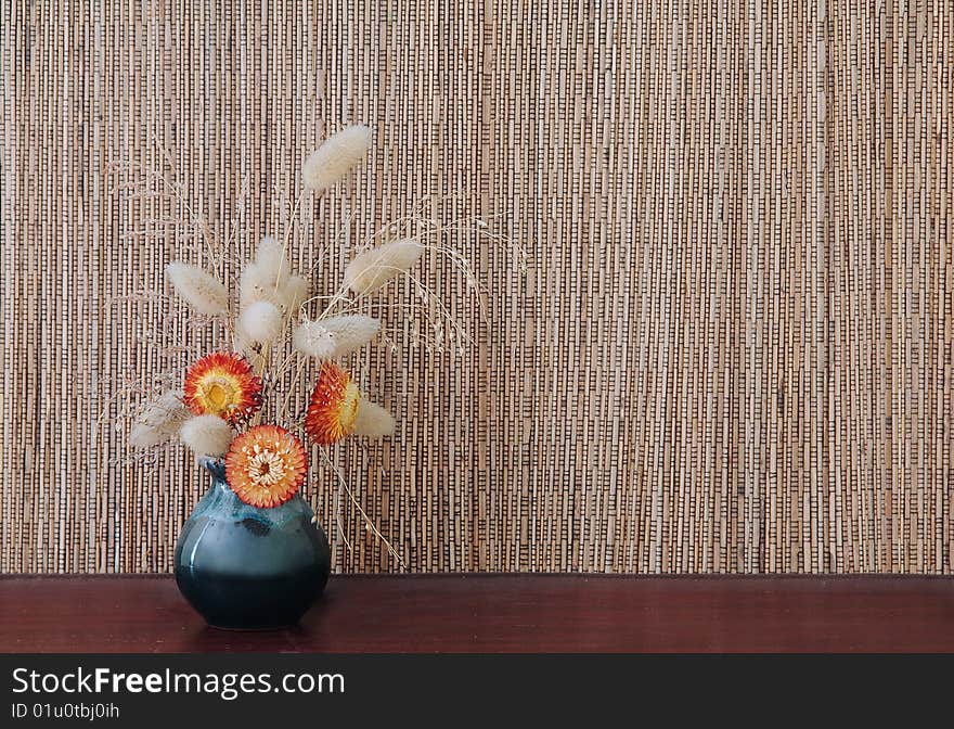 Ikebana on brown natural background