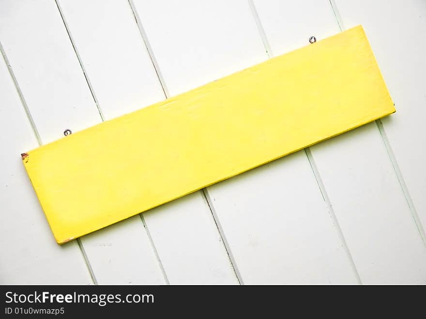 Blank Yellow Sign on Panel Wall