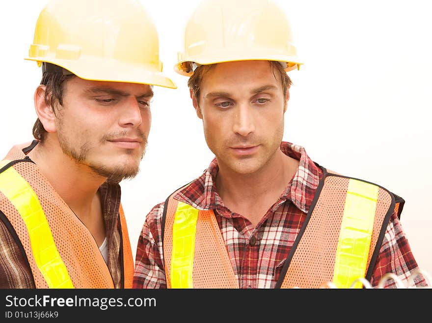 Two Construction Workers at the job working together