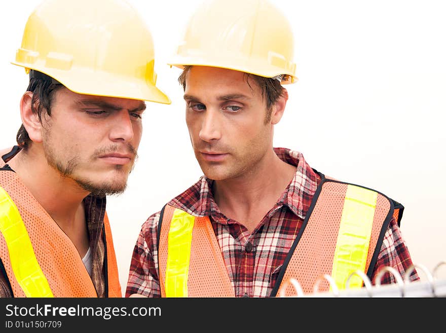 Two Construction Workers at the job working together