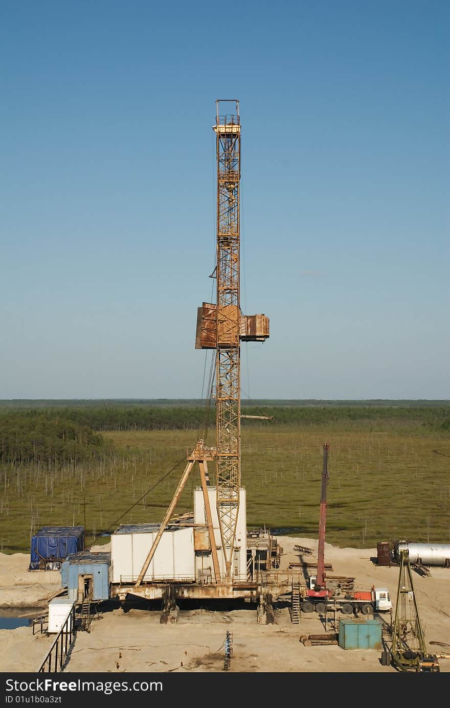 Oil industry on a background an of the taiga edge. Oil industry on a background an of the taiga edge