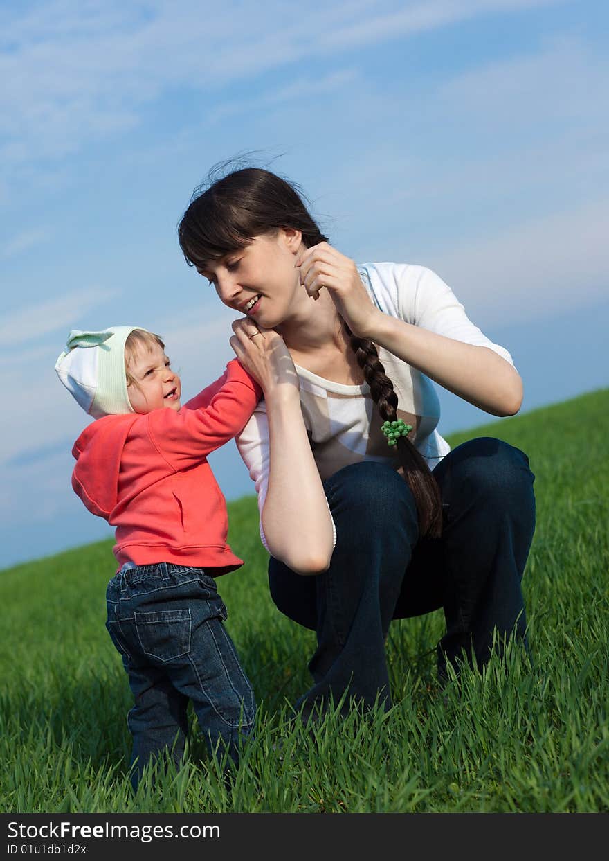 Portrait of a little girl with mom outdoors