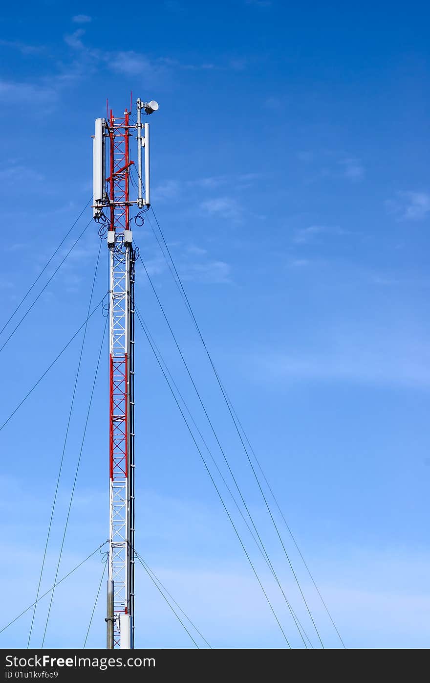 Telecommunication tower on a sky background