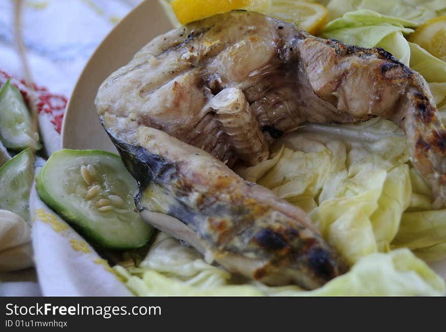 Close up with healthy fish, sheatfish, with lemon