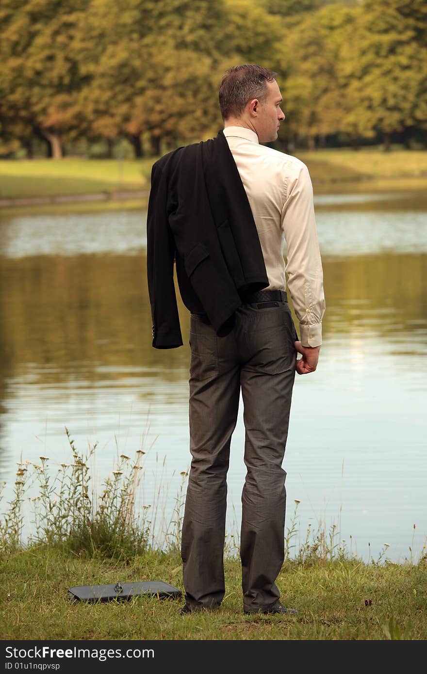 Man With Jacket At The Shore