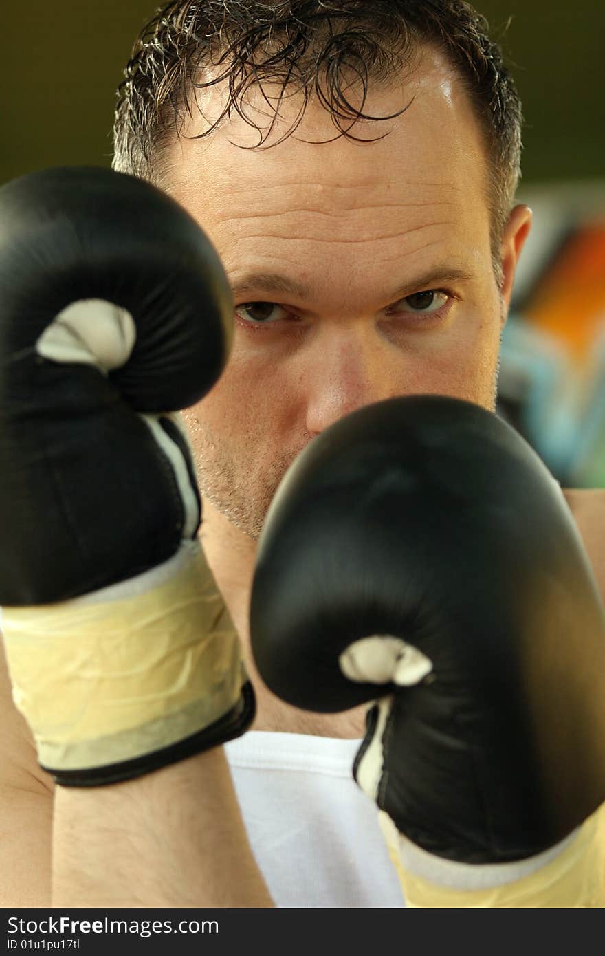 Portrait of male boxer on the street